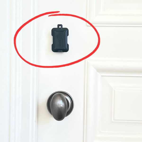 Kini: Wireless Motion Sensor with Realtime SMS Alerts attached to door above knob.